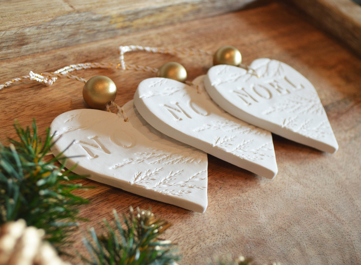 3 pure white heart shaped NOEL ornaments