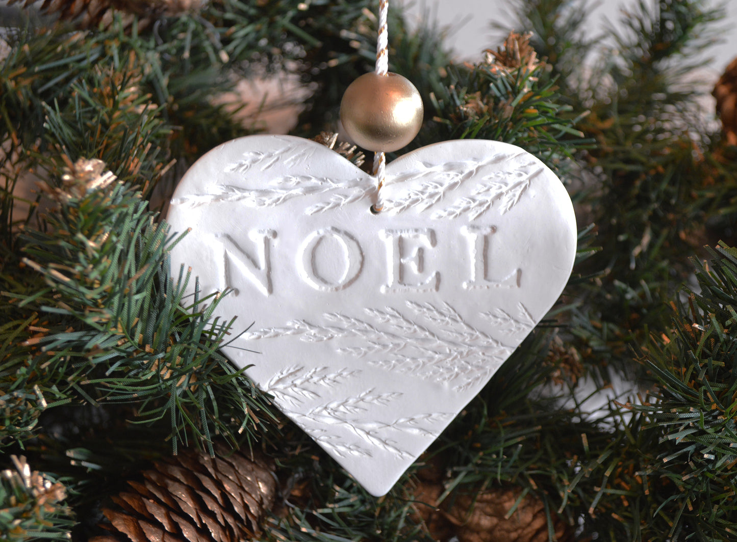 3 pure white heart shaped NOEL ornaments